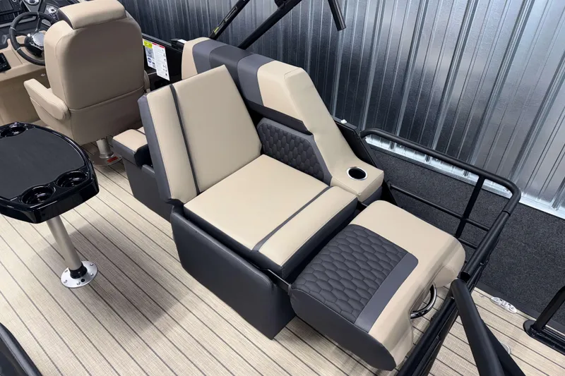Slide: The Image of Luxurious seating on 2026 Sylvan L1 LZ boat with cup holder and sleek design. - 6