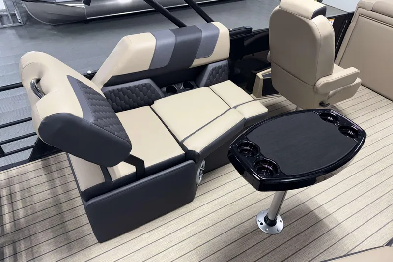 Slide: The Image of Luxurious seating and table setup on 2026 Sylvan L1 LZ boat interior. - 7