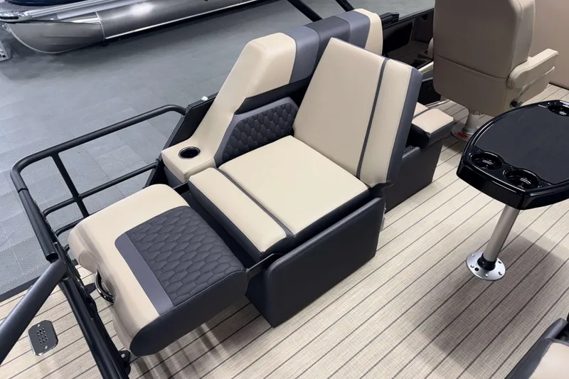Slide: The Image of Luxurious seating on 2026 Sylvan L1 LZ pontoon boat with cup holders and table. - 8