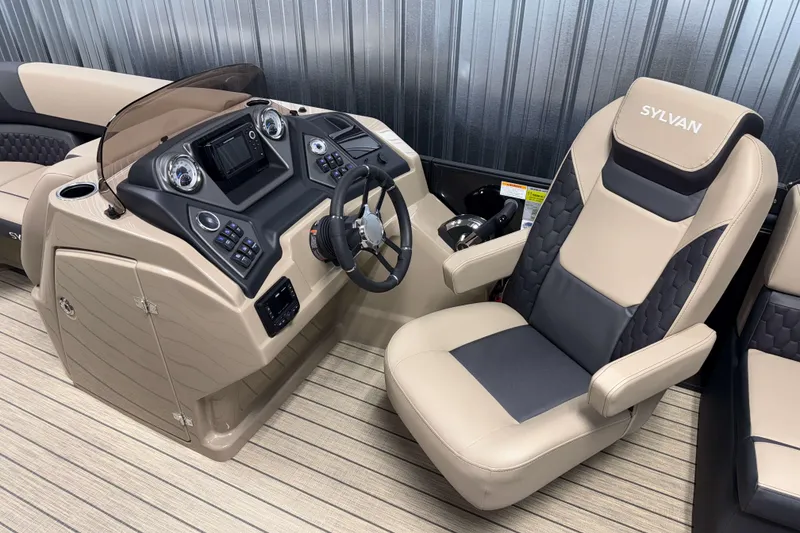 Slide: The Image of 2026 Sylvan L1 LZ boat interior with steering console and captain's chair. - 9