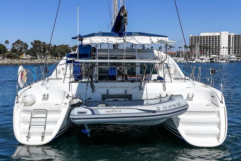 Slide: The Image of 2004 Lagoon 380 catamaran docked at Santa Catalina Island, CA, with inflatable dinghy. - 14
