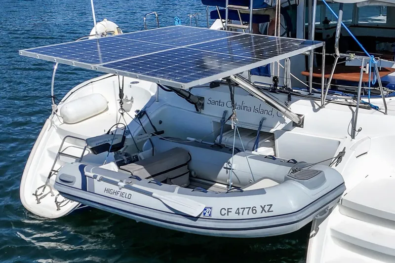 Slide: The Image of Lagoon 380 catamaran with solar panels and dinghy, anchored near Santa Catalina Island, 2004 model. - 16