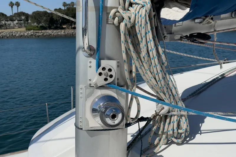 Slide: The Image of Close-up of a 2004 Lagoon 380 sailboat mast with ropes and winch. - 29