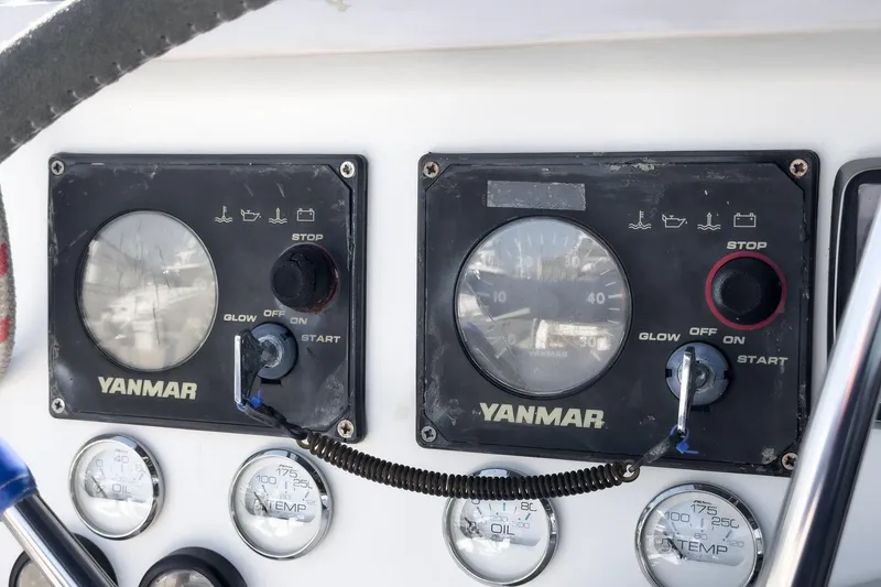 Slide: The Image of Control panel of a 2004 Lagoon 380 catamaran with Yanmar engine gauges. - 40