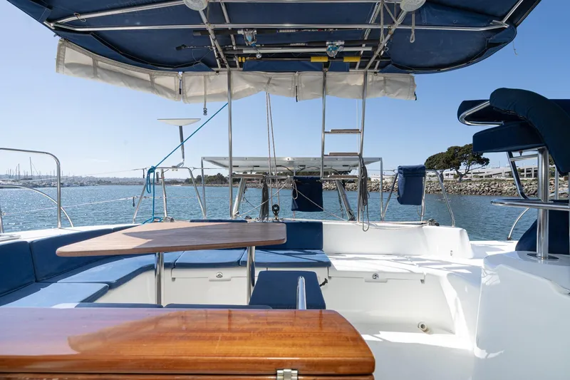 Slide: The Image of Spacious deck of a 2004 Lagoon 380 catamaran with seating and ocean view. - 41