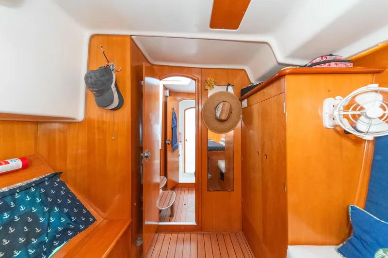 Slide: The Image of Interior of 2004 Lagoon 380 catamaran with wooden finish and nautical decor. - 58
