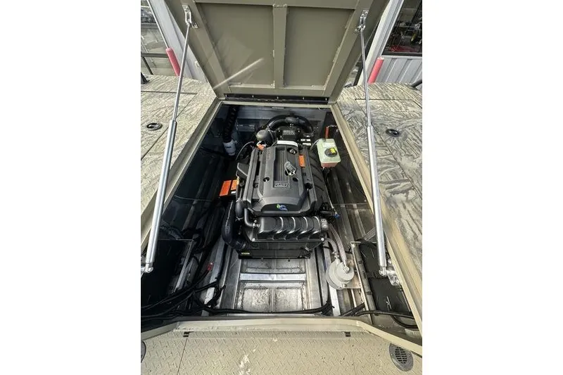 Slide: The Image of Engine compartment of 2025 SeaArk Predator 300 AK boat, showcasing modern design and components. - 13