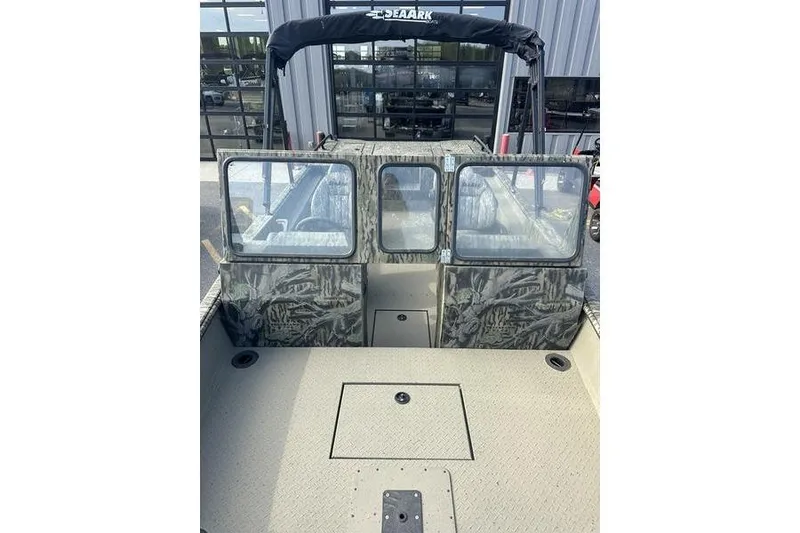 Slide: The Image of 2025 SeaArk Predator 300 AK boat with camouflage design and spacious deck. - 16