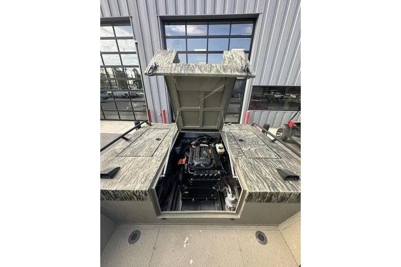 Slide: The Image of 2025 SeaArk Predator 300 AK boat engine compartment open, showcasing interior mechanics. - 4