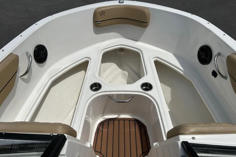 Slide: The Image of 2023 Bayliner VR4 Bowrider OB interior with seating and cup holders. - 13