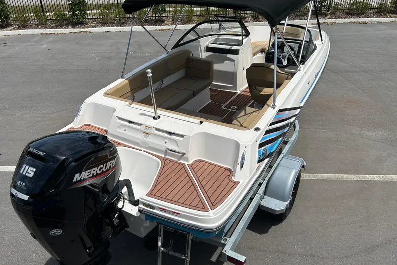 Slide: The Image of 2023 Bayliner VR4 Bowrider OB with Mercury 115 engine on trailer. - 7