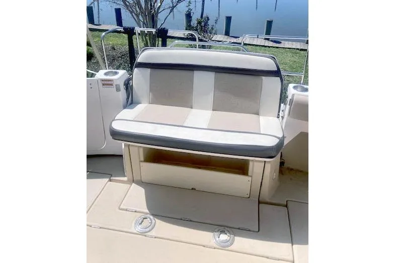 Slide: The Image of 2018 Cutwater C-30 Sedan boat seat with storage, dockside view. - 10