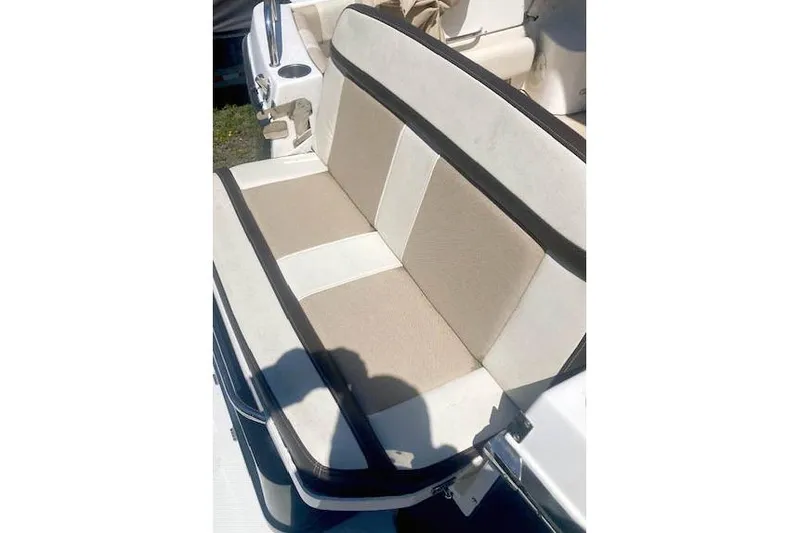Slide: The Image of 2018 Cutwater C-30 Sedan boat seat with beige and white upholstery. - 11