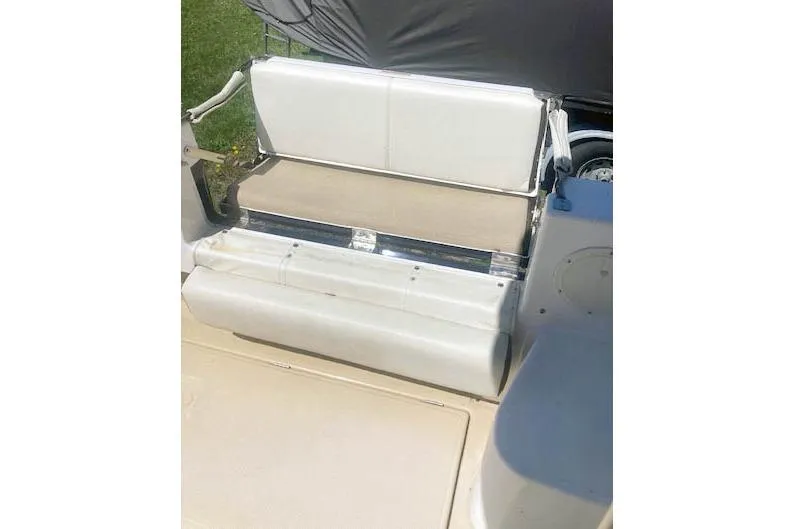 Slide: The Image of 2018 Cutwater C-30 Sedan boat seat with white upholstery and storage compartment. - 12