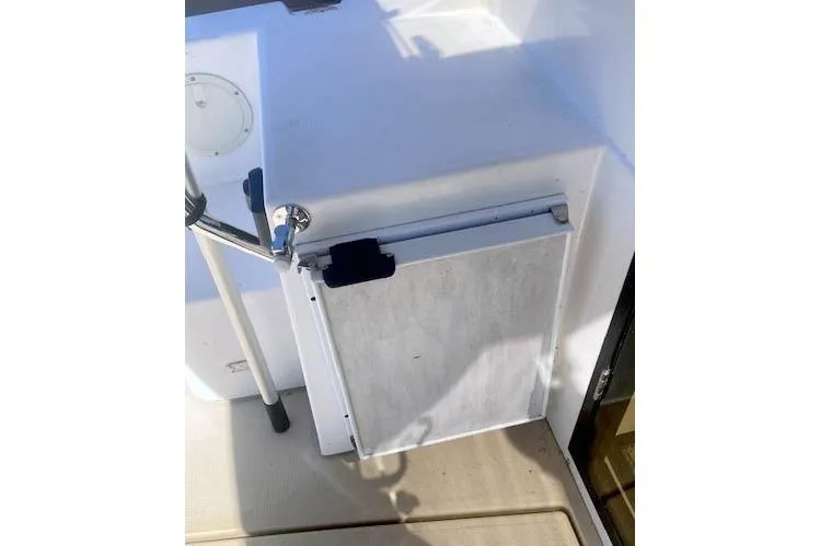 Slide: The Image of 2018 Cutwater C-30 Sedan boat deck with storage compartment and railing. - 13