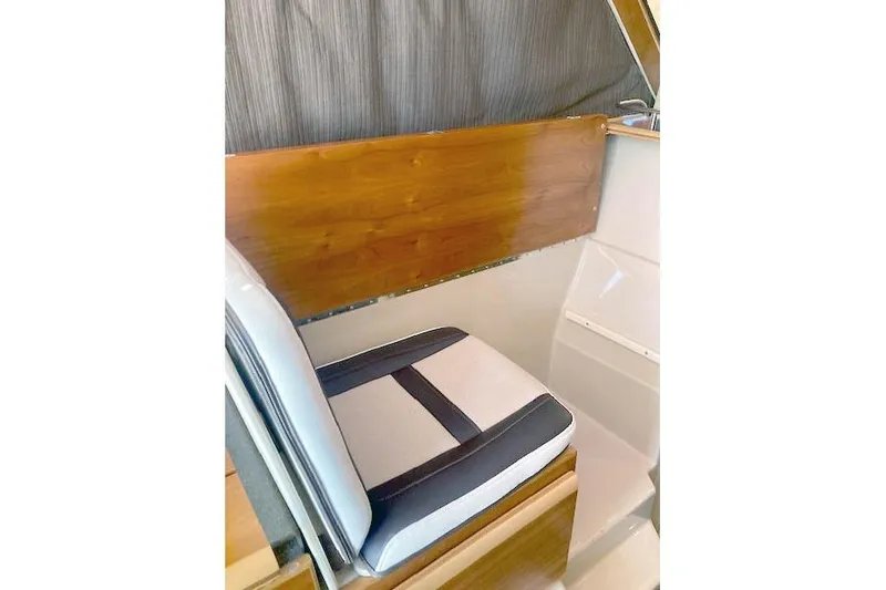 Slide: The Image of Interior seating of 2018 Cutwater C-30 Sedan boat with wood paneling. - 18