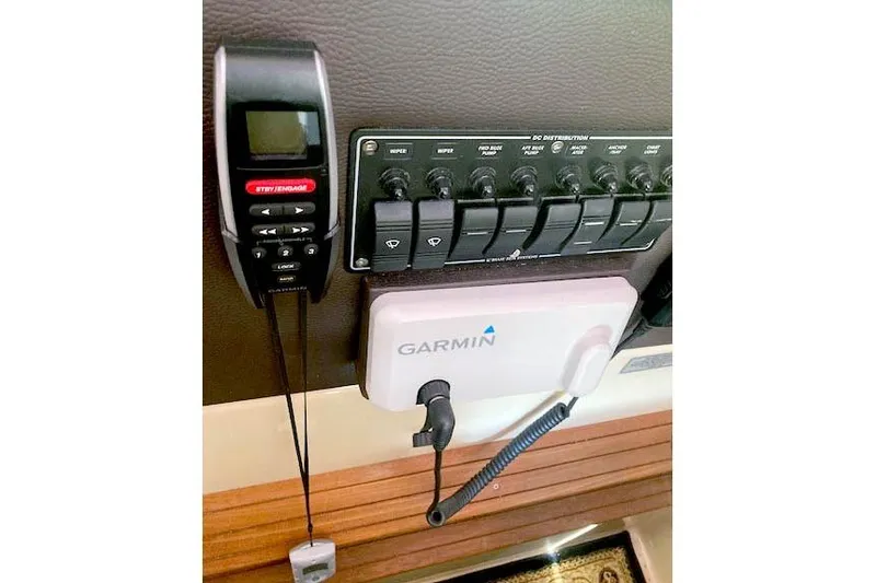 Slide: The Image of Control panel and Garmin device in 2018 Cutwater C-30 Sedan boat interior. - 26