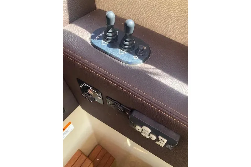 Slide: The Image of Control panel of a 2018 Cutwater C-30 Sedan boat with dual joysticks. - 27