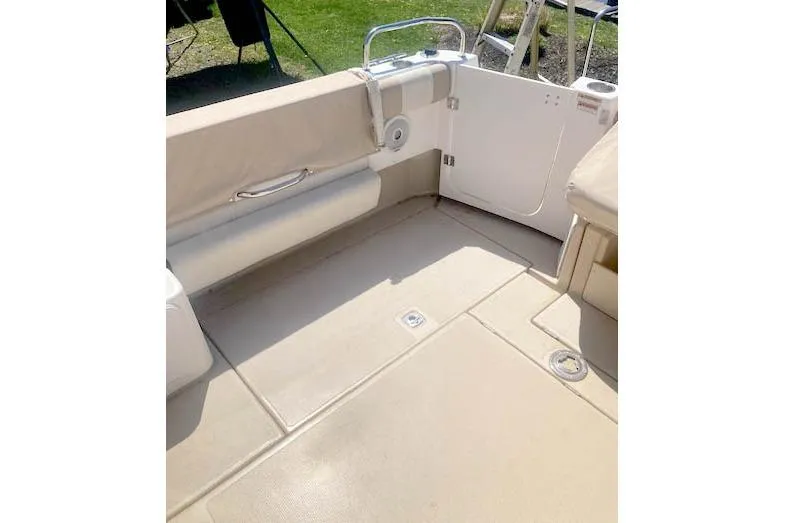Slide: The Image of 2018 Cutwater C-30 Sedan boat interior with beige seating and deck. - 7