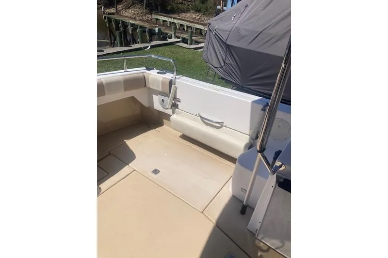 Slide: The Image of 2018 Cutwater C-30 Sedan boat interior with beige seating and deck. - 8