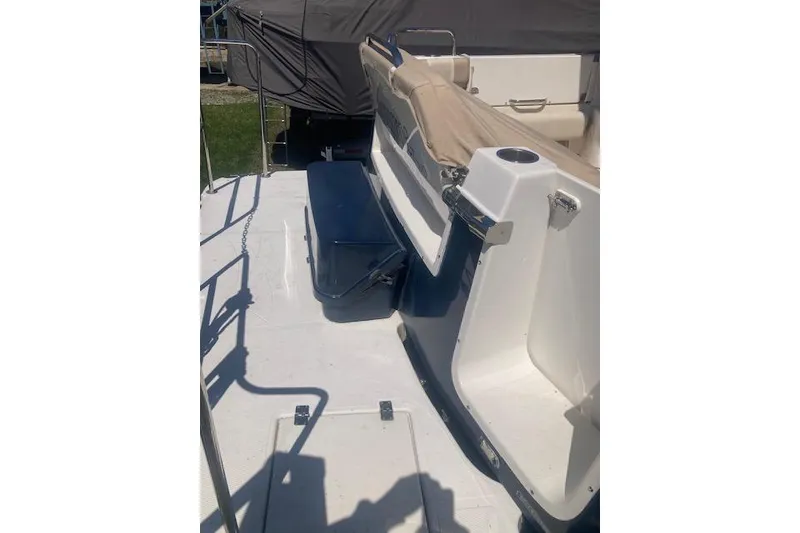 Slide: The Image of 2018 Cutwater C-30 Sedan boat deck with seating and storage compartments. - 9