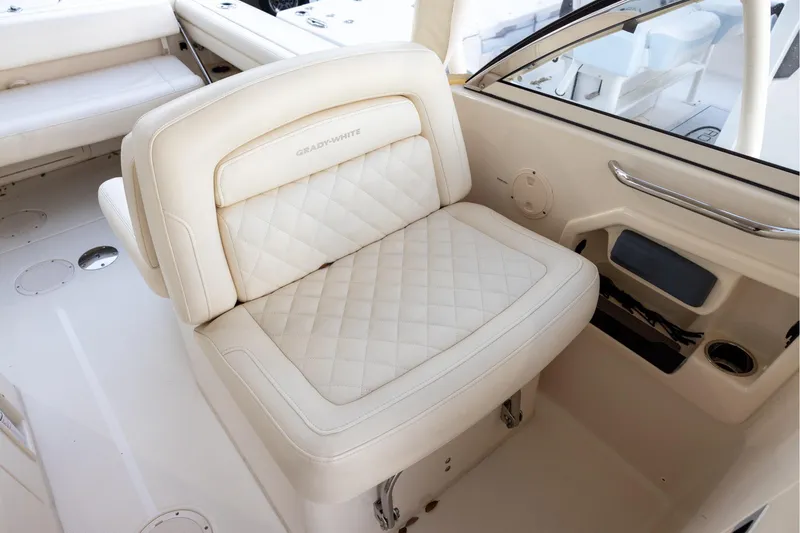 Slide: The Image of Luxurious seating on 2018 Grady-White Freedom 285 boat, featuring quilted upholstery. - 13