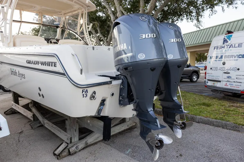 Slide: The Image of 2018 Grady-White Freedom 285 boat with twin Yamaha 300 engines on display. - 2