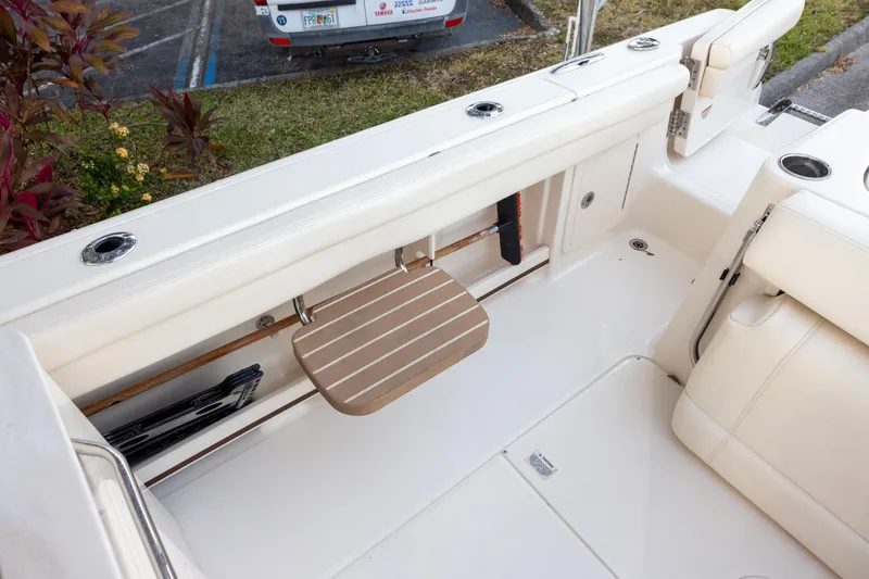 Slide: The Image of 2018 Grady-White Freedom 285 boat interior with seating and storage compartments. - 5