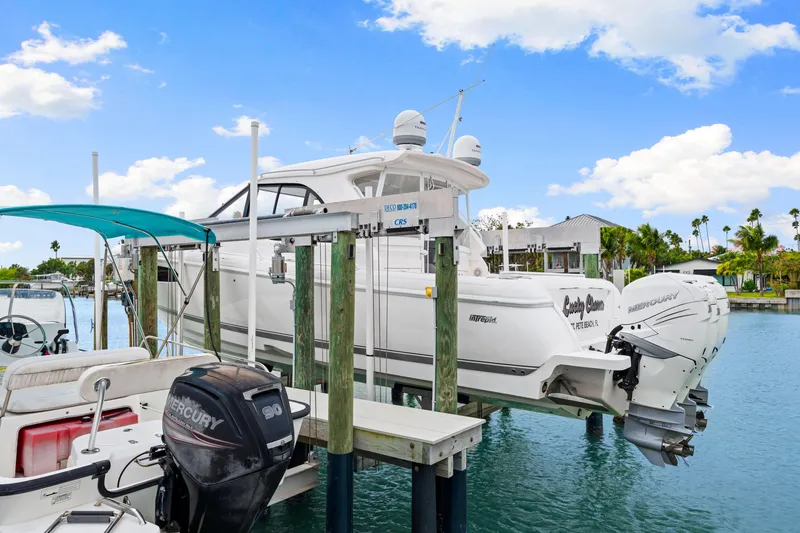 Slide: The Image of 2019 Intrepid 410 Evolution yacht docked with twin Mercury engines. - 14