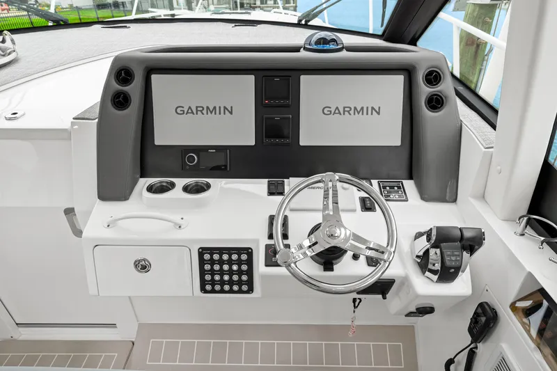 Slide: The Image of Helm of 2019 Intrepid 410 Evolution with Garmin displays and modern controls. - 45