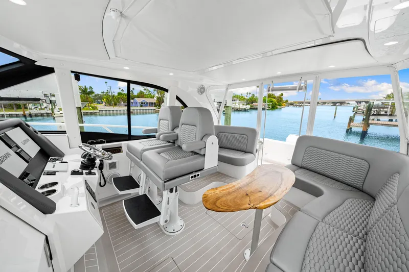 Slide: The Image of Luxurious interior of 2019 Intrepid 410 Evolution yacht with modern seating and scenic water views. - 46