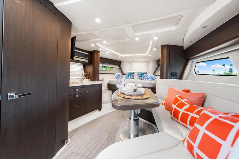 Slide: The Image of Luxurious interior of 2019 Intrepid 410 Evolution yacht with modern kitchen and cozy seating area. - 51