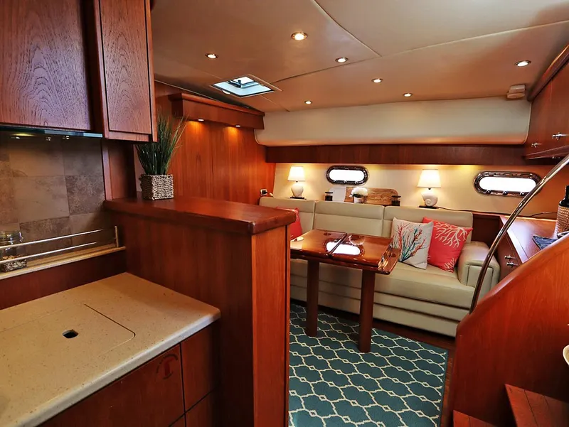 Slide: The Image of Luxurious interior of 2009 Tiara Yachts 4300 Sovran with elegant wood finishes and cozy seating. - 10