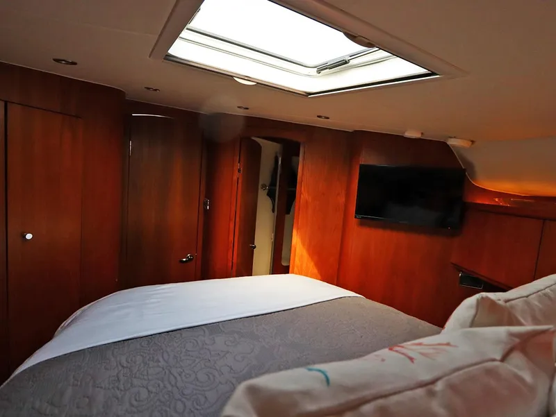 Slide: The Image of Luxurious cabin interior of 2009 Tiara Yachts 4300 Sovran with skylight and TV. - 16