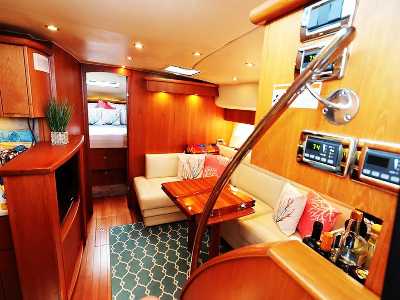 Slide: The Image of Luxurious interior of 2009 Tiara Yachts 4300 Sovran with elegant wood finishes and cozy seating. - 2