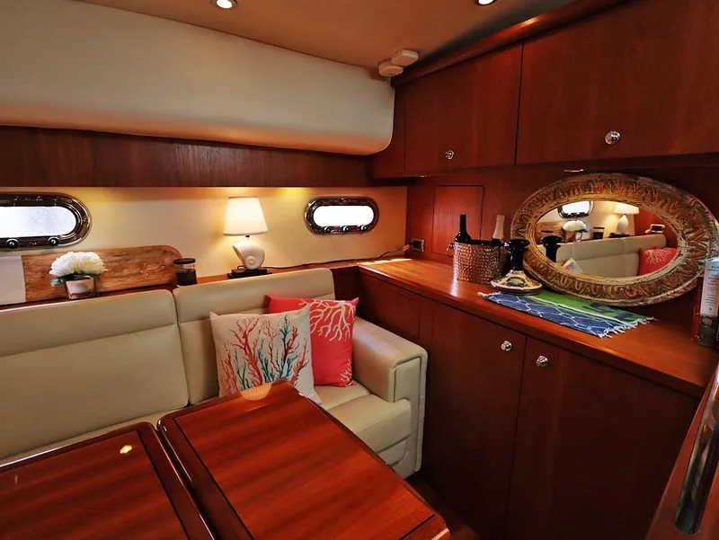 Slide: The Image of Luxurious interior of 2009 Tiara Yachts 4300 Sovran with elegant wood finish and cozy seating. - 4
