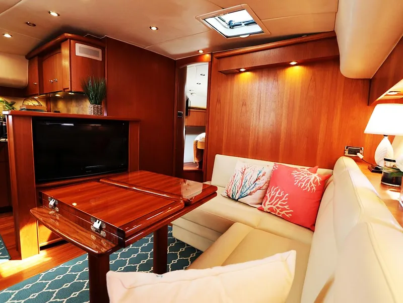 Slide: The Image of Luxurious interior of 2009 Tiara Yachts 4300 Sovran with elegant wood finish and cozy seating. - 6