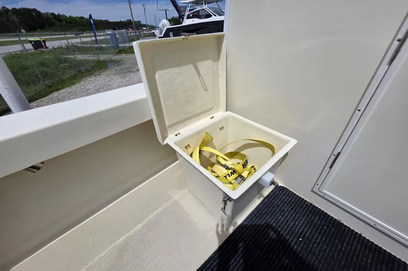 Slide: The Image of Open storage compartment on 2018 Rosborough 22 Cape Breton boat, featuring yellow straps inside. - 10