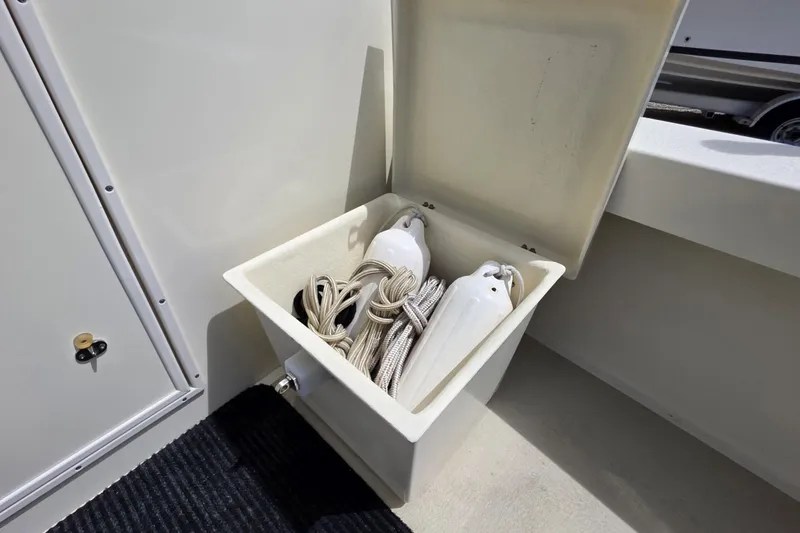 Slide: The Image of Storage compartment on 2018 Rosborough 22 CAPE BRETON boat with ropes and fenders. - 11