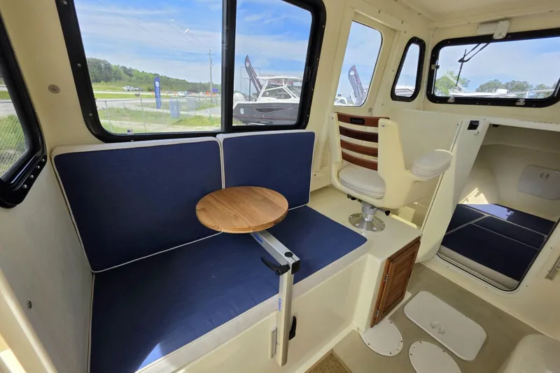 Slide: The Image of Interior of 2018 Rosborough 22 Cape Breton boat with seating and table. - 14