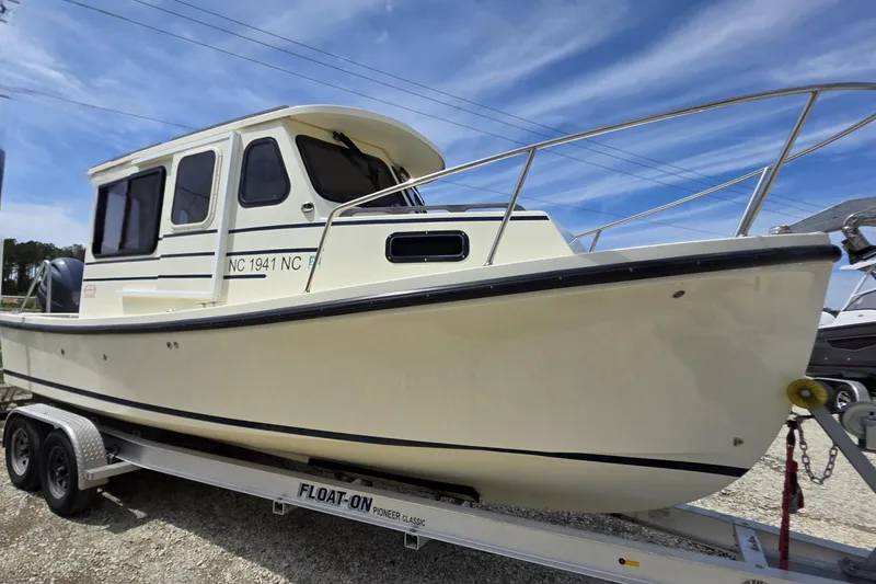 Slide: The Image of 2018 Rosborough 22 Cape Breton boat on trailer under clear blue sky. - 2