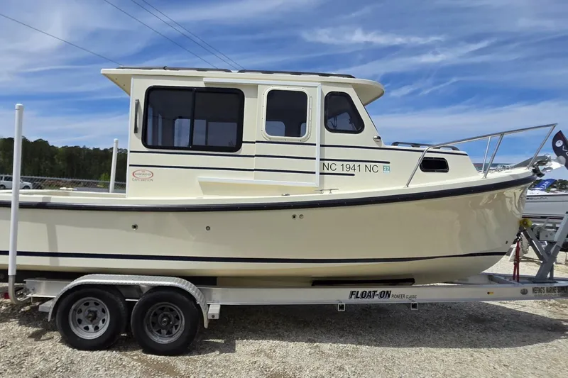 Slide: The Image of 2018 Rosborough 22 Cape Breton boat on trailer under clear sky. - 3