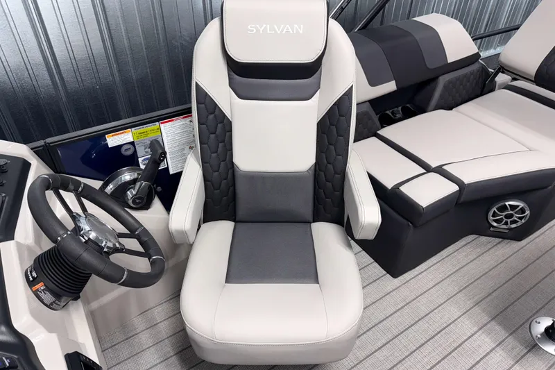 Slide: The Image of 2026 Sylvan L1 LZ boat interior with luxurious seating and modern steering wheel design. - 10