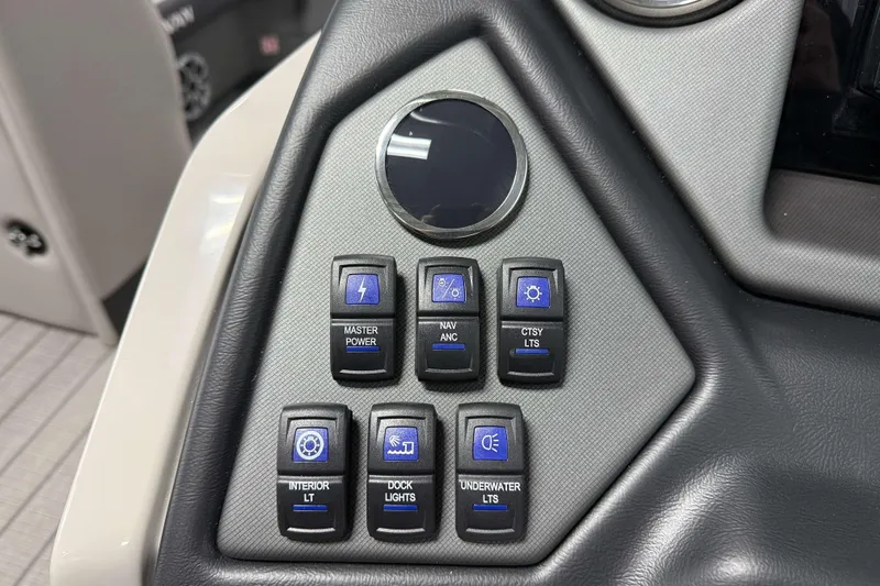 Slide: The Image of Control panel of 2026 Sylvan L1 LZ boat with various switches and buttons. - 13