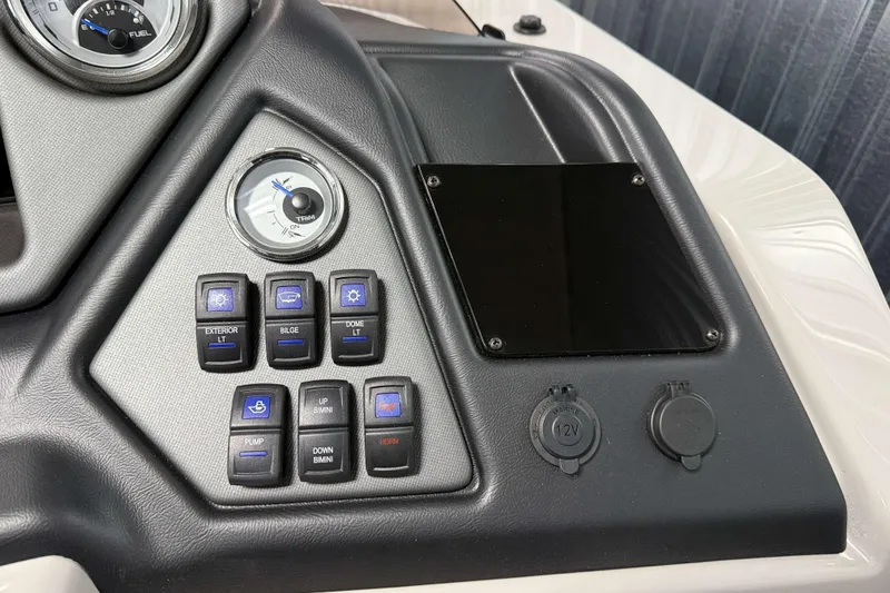 Slide: The Image of Control panel of 2026 Sylvan L1 LZ boat with switches and gauges. - 14