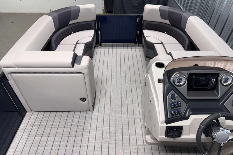 Slide: The Image of 2026 Sylvan L1 LZ boat interior with modern seating and control panel. - 16