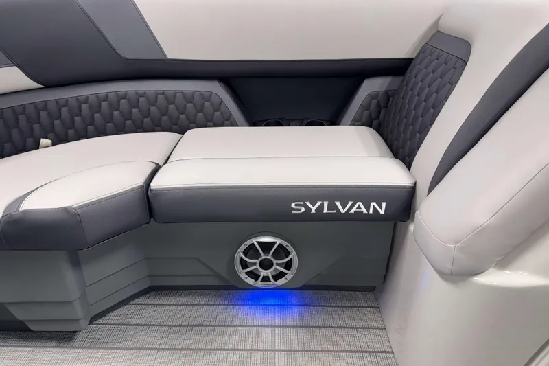 Slide: The Image of 2026 Sylvan L1 LZ boat interior with cushioned seating and speaker. - 19