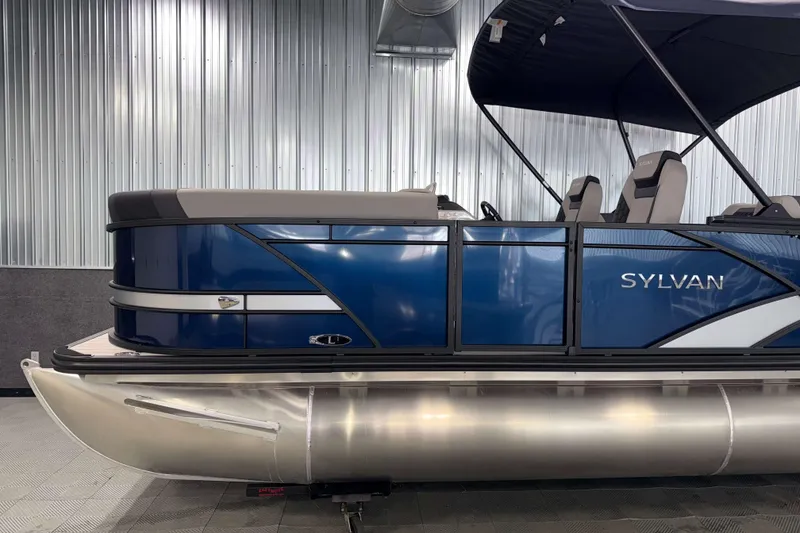Slide: The Image of 2026 Sylvan L1 LZ pontoon boat with sleek blue design and modern seating. - 23