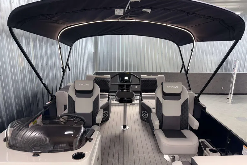Slide: The Image of 2026 Sylvan L1 LZ pontoon boat interior with canopy and modern seating. - 29