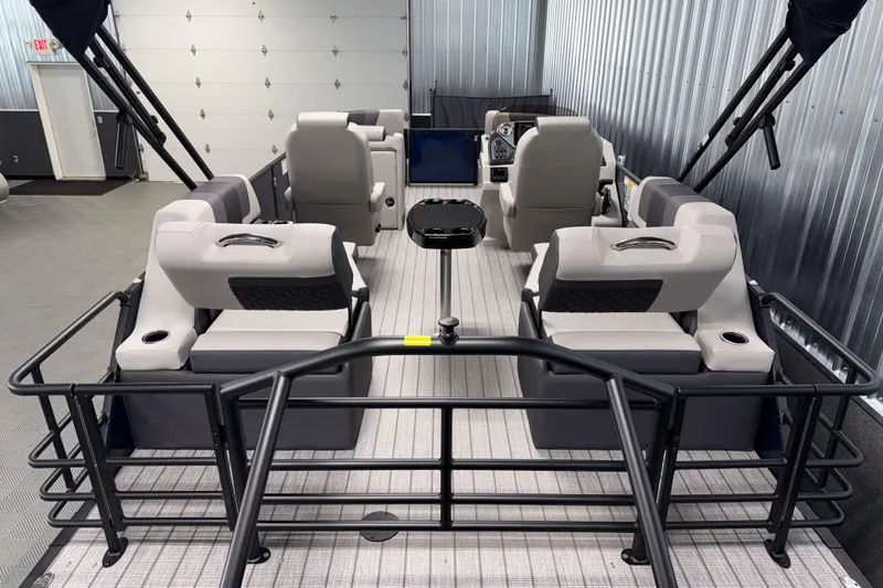 Slide: The Image of 2026 Sylvan L1 LZ pontoon boat interior with plush seating and modern design. - 3